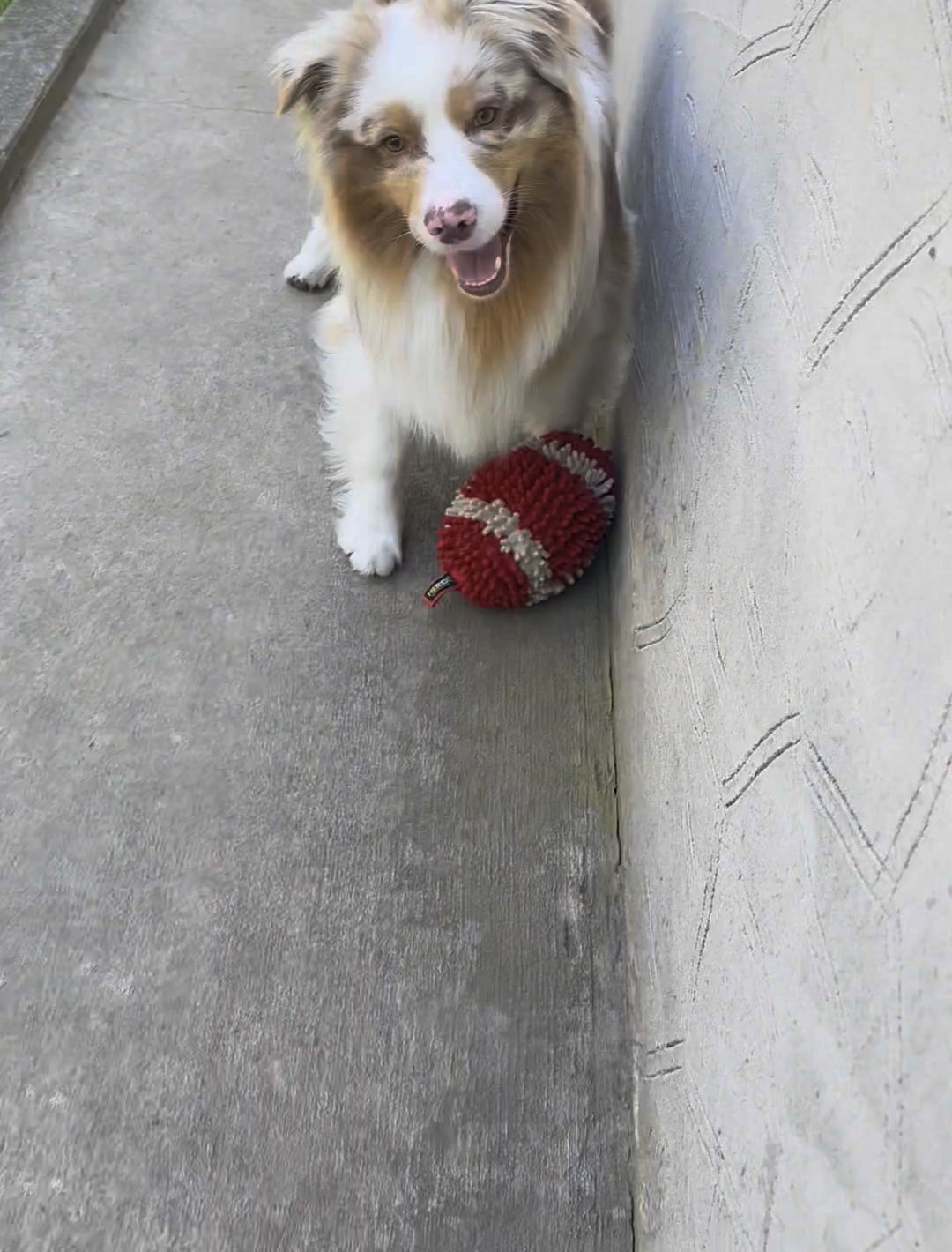 Kai with the red and white HERO chenille football